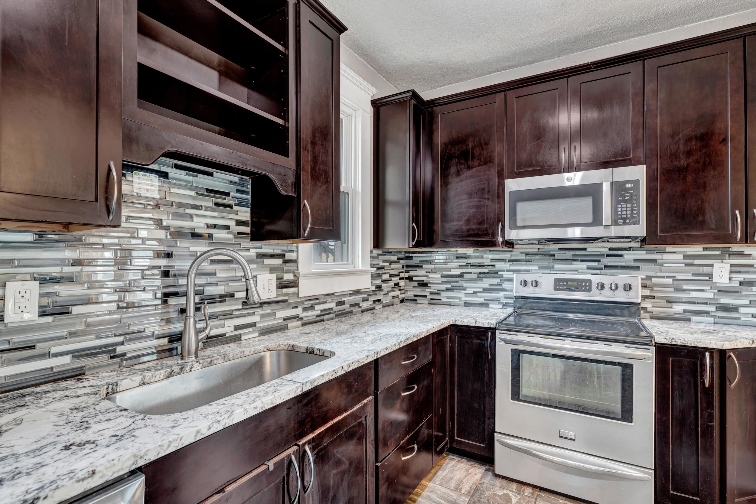 Kitchen with electric range and dishwasher