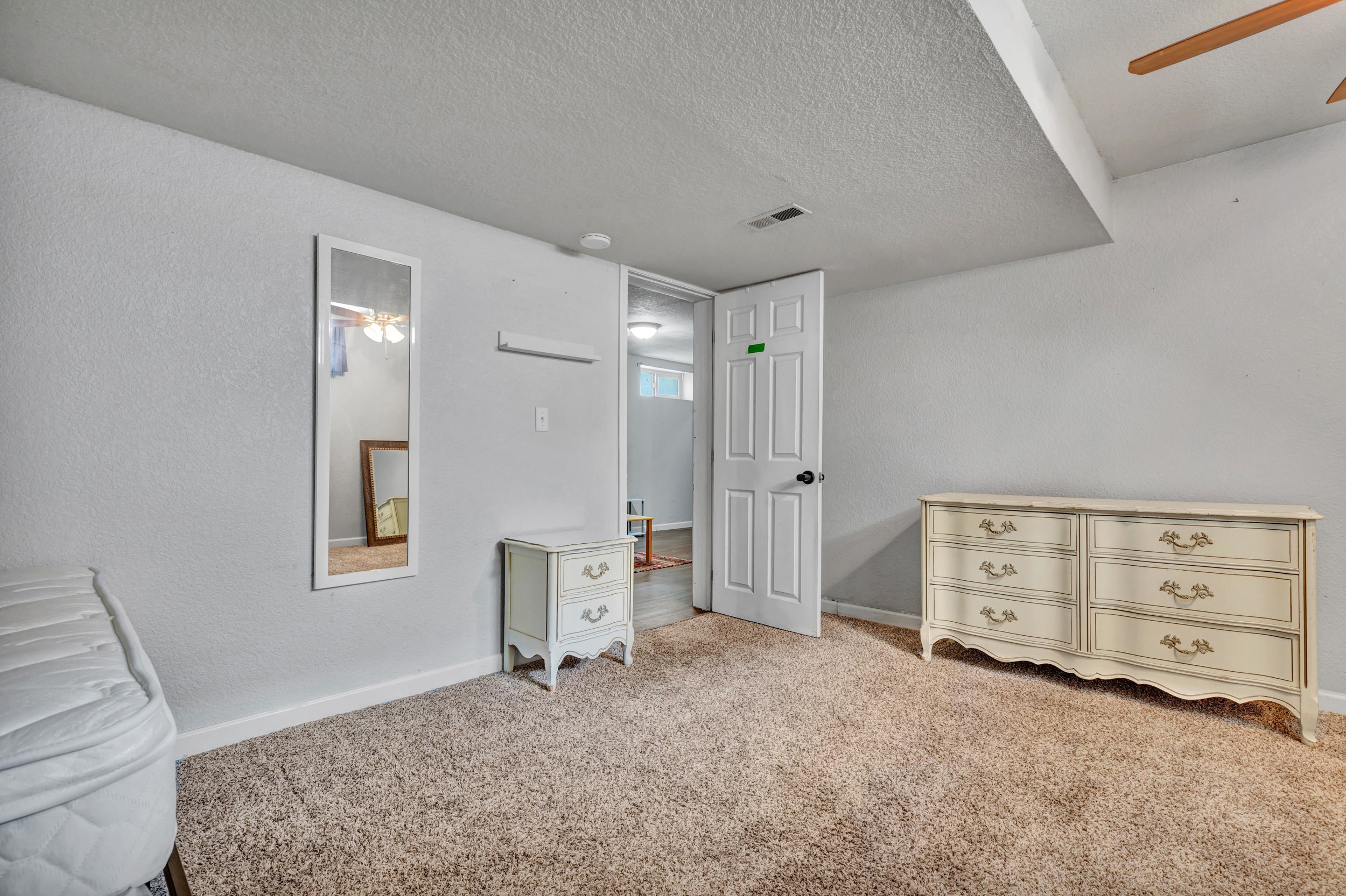 Carpeted lower-level bedroom
